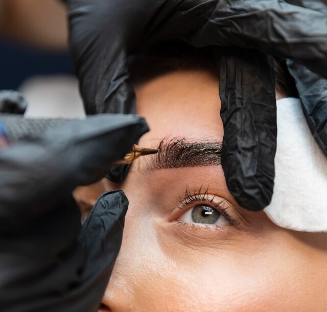 young-woman-getting-beauty-treatment-her-eyebrows